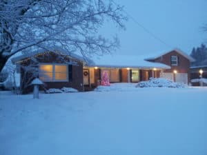 house with holiday lights and snow | the DAWN Method